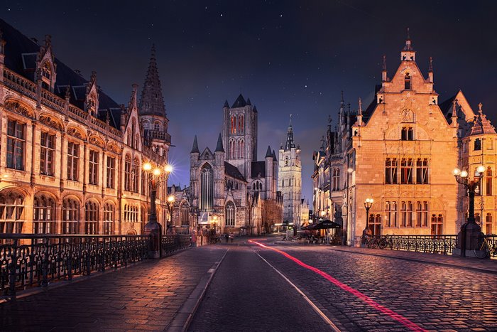 Old buildings and church in Ghent, Belgium at night