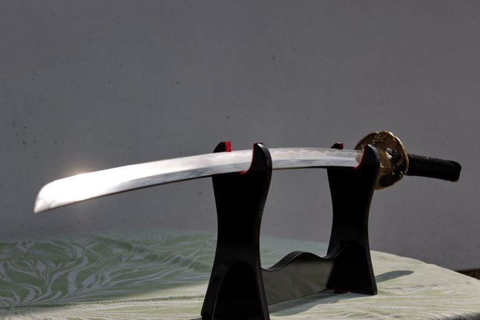 Katana sword on a black stand