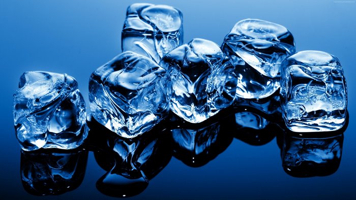 Ice cubes on a blue reflective surface