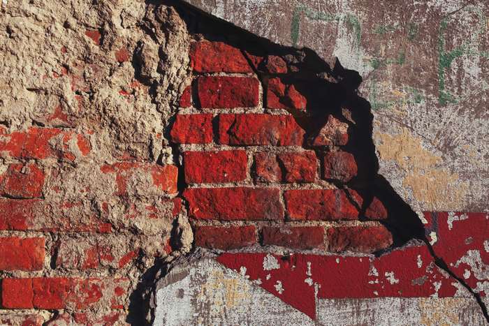 Old destroyed brick wall with plaster 4K