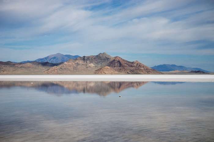 Mountains reflected in water at salt flats