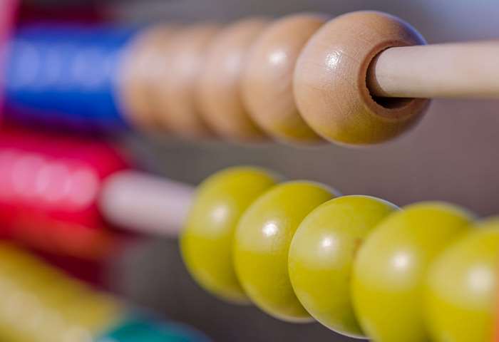 Close-up of a colorful wooden abacus with beads