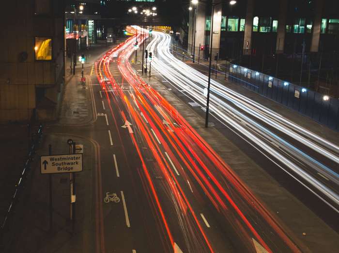 Light painting of traffic on a city street at night