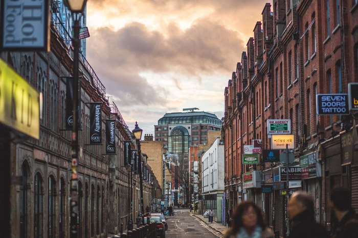 Street in London with University banners and shops 4K