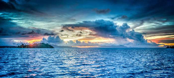 Tropical island sunset over the ocean 4K