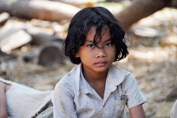 Young Asian child in dirty shirt, Cambodia 4K