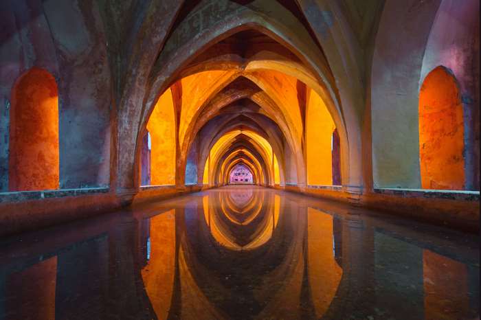 Hallway with arches and water reflection in Spain 4K