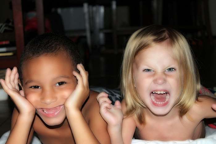 Two children making faces