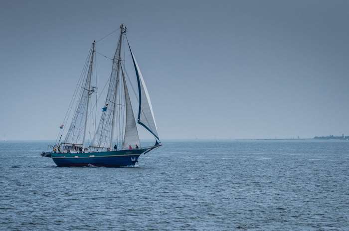 Blue sailboat on the sea 4K