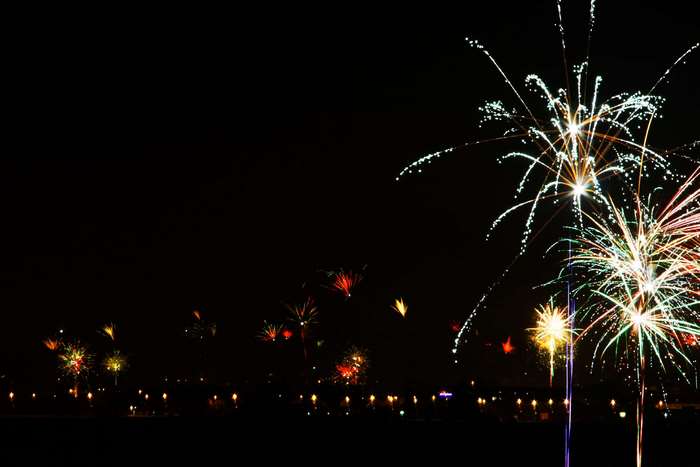 Fireworks display over a city at night