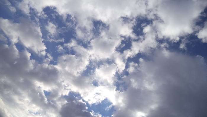 Gray and white clouds in a blue sky