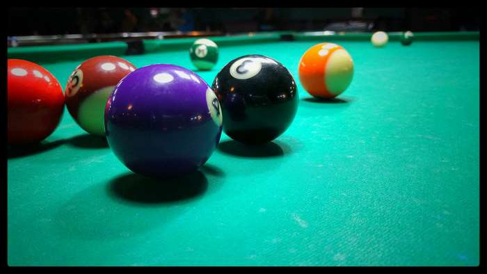 Billiard balls on a green table 4K