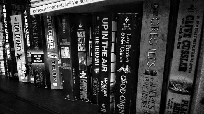 Books on a Shelf: Clive Cussler, Tom Clancy, Greg Iles
