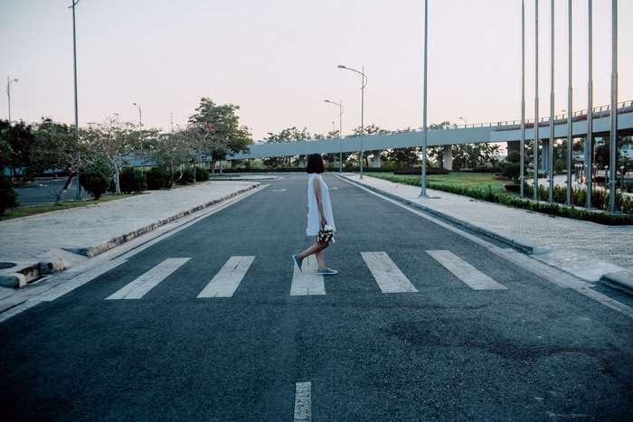 Woman walking on a crosswalk
