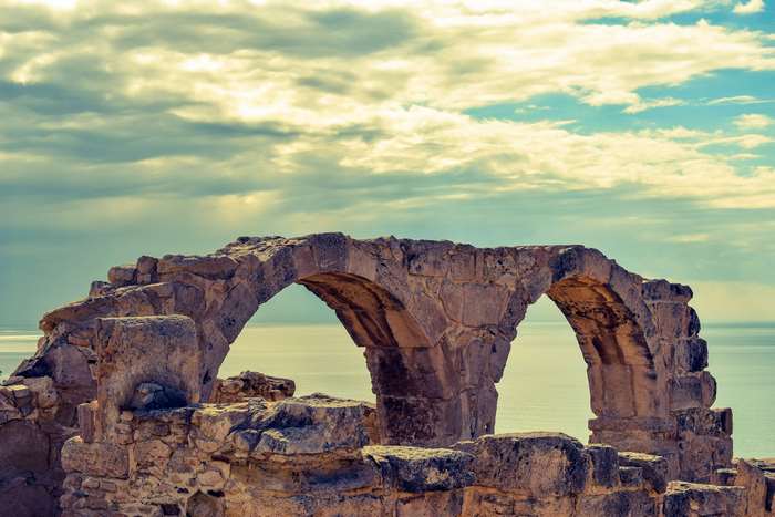 Ancient stone arches of Kourion ruins in Cyprus