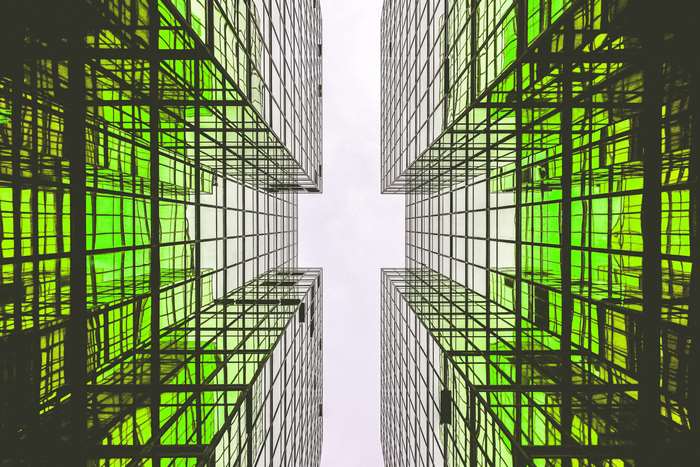 Modern glass buildings with green tint