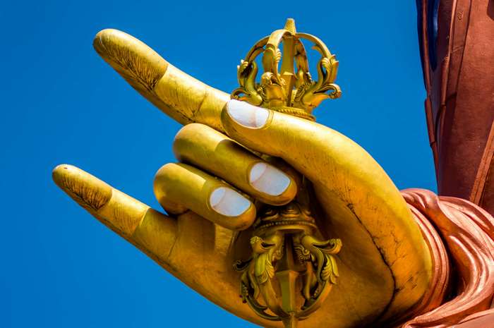 Golden Buddha Hand Holding a Crown Sculpture