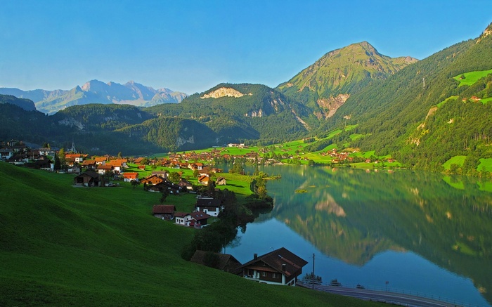Village on a lake with mountains