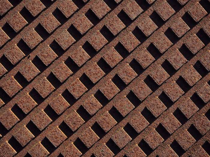 Rusty metal grid texture with diagonal pattern
