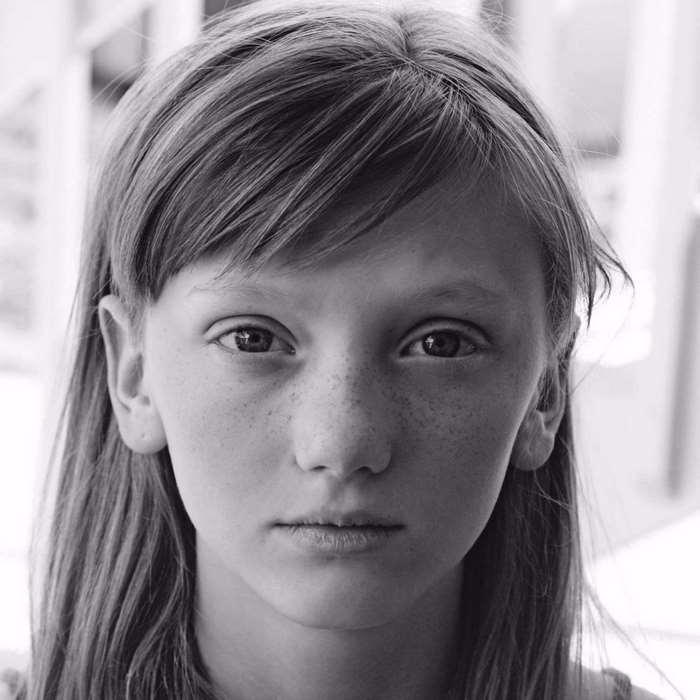 Portrait of a young girl with freckles