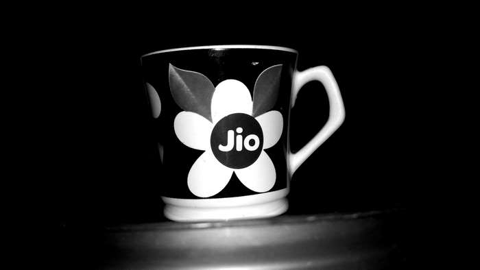 Black and white coffee cup with Jio logo