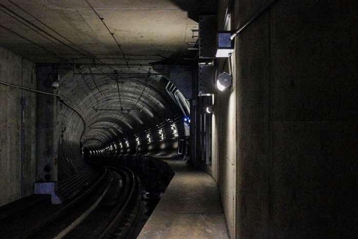 Subway tunnel with railway tracks and lights 4K