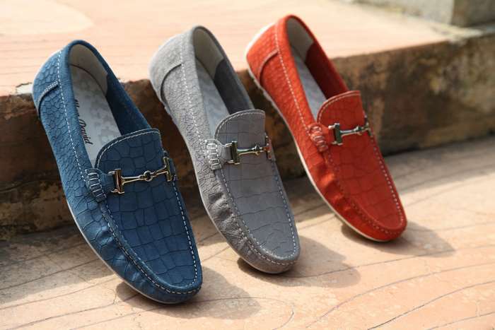 Three pairs of leather loafers with metal buckles