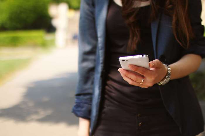 Woman holding a smartphone