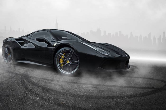Black Ferrari 488 GTB doing a burnout