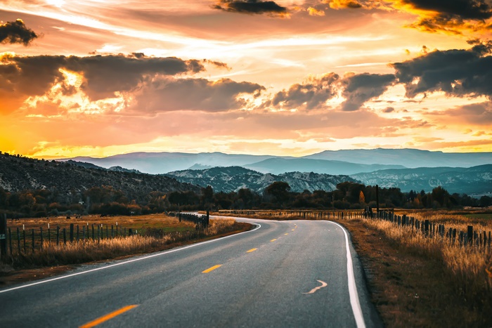 Road through a landscape at sunset