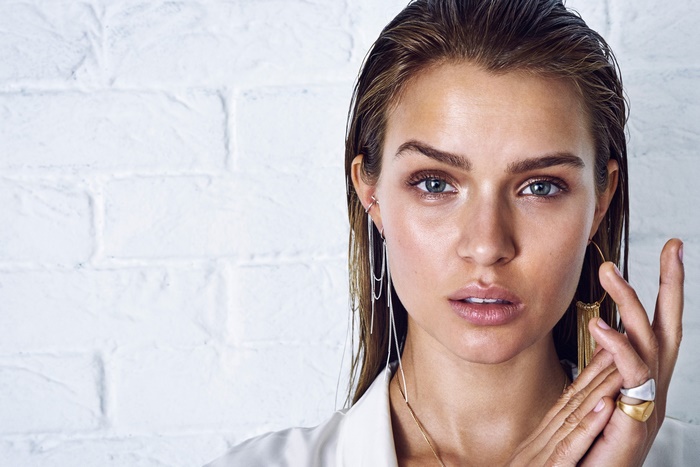 Josephine Skriver with wet hair and jewelry