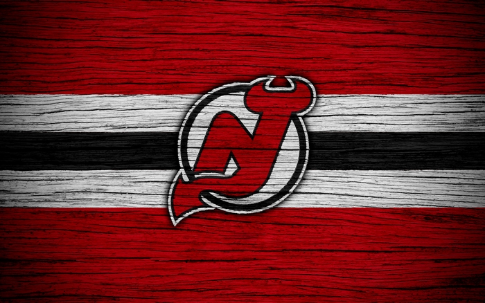 New Jersey Devils logo on a wooden background