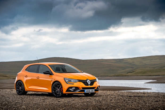 Orange Renault Megane RS parked by a lake