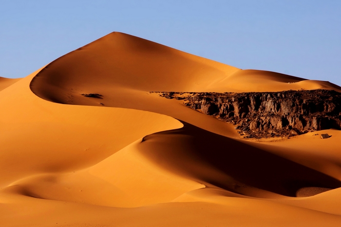 Golden Sand Dunes of Sahara Desert in Algeria