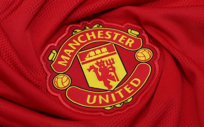 Manchester United F.C. logo on red fabric