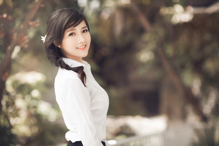 Smiling Korean Woman with Braided Black Hair