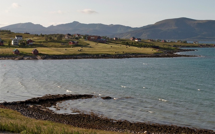 Coastal village with mountains and sea