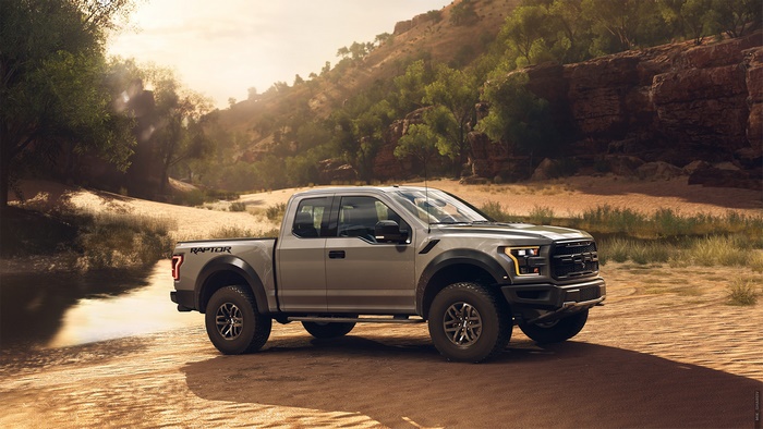 Ford Raptor truck in a desert landscape