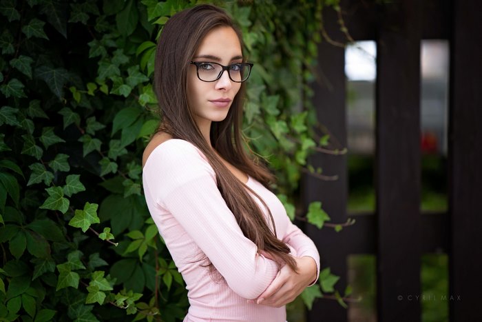 Woman with glasses and long brown hair