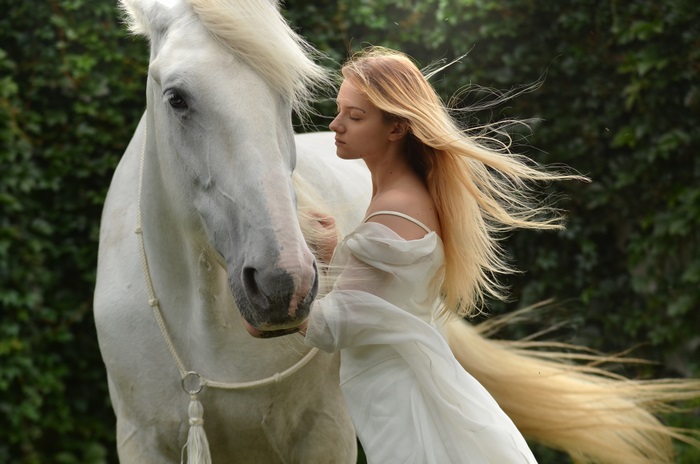 Blonde Woman with Long Hair and White Horse
