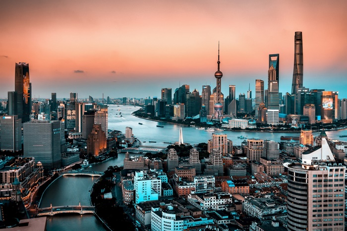 Shanghai cityscape with Oriental Pearl Tower and skyscrapers at sunset