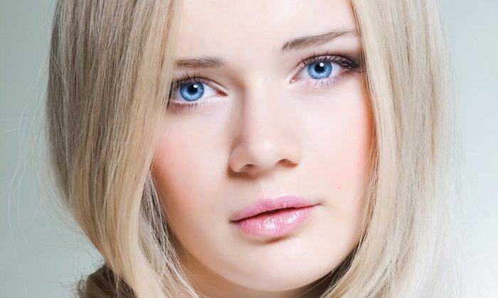 Close-up Portrait of Blonde Woman with Blue Eyes