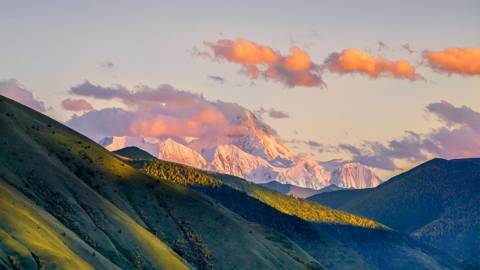 Mountains with colorful clouds at sunset