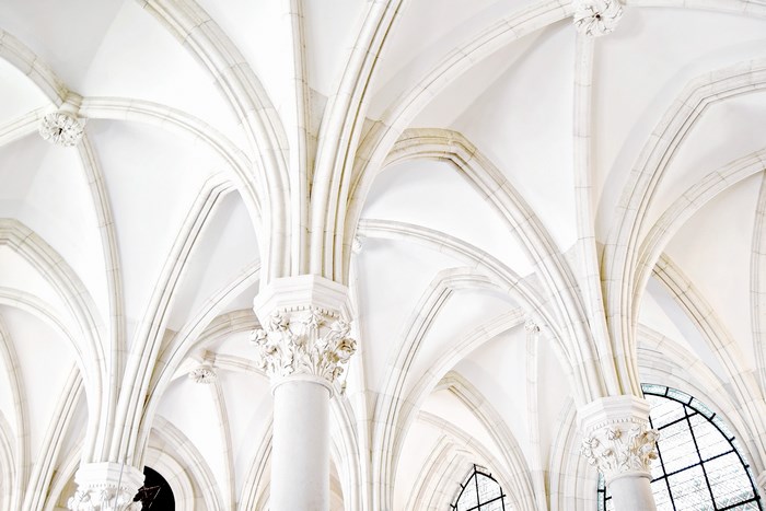 White Gothic vaulted ceiling with ornate columns