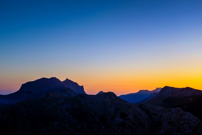 Mountain range silhouette at sunrise over Serra de Tramuntana