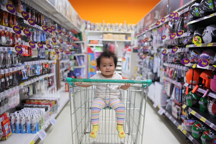Baby in shopping cart at Lotus supermarket
