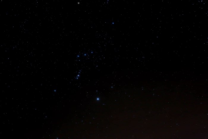 Night sky with Orion constellation and stars