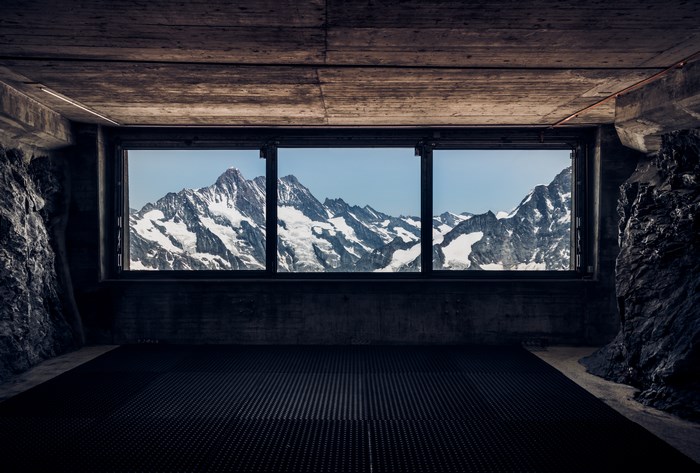 View of snowcapped mountains from an indoor viewpoint
