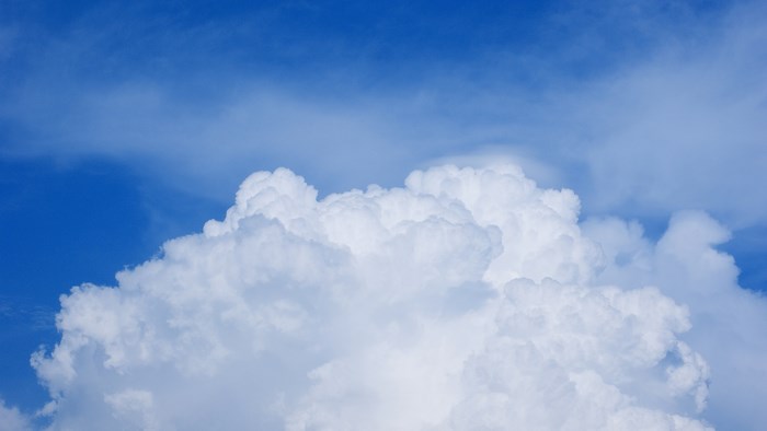Blue sky with white cumulus clouds