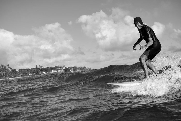 Man surfing a wave near Honolulu, USA